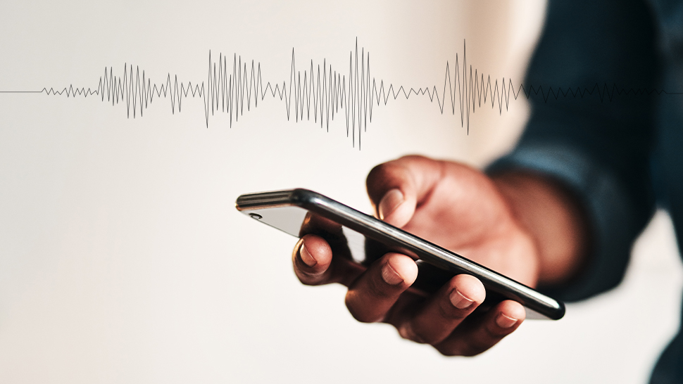 Close-up of a hand holding a smartphone with sound wave graphics, symbolising the act of recording workplace harassment, relevant to Locate Solicitors' legal services.